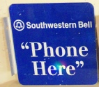 Phone Here payphone sign